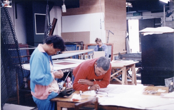 Title: b'Robert Campbell junior, working at the Australian Print Workshop, Melbourne on his linocut for the Bicentennial Folio. Pam Debenham in the background' | Date: 1988