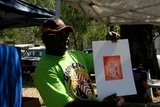 Title: b'Abe Muriati with his first etching  pruduced at Djumbunji Press, Laura Dance Festival, Laura, Queensland.'