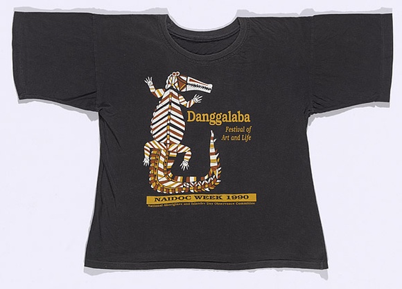 Artist: b'Territory Track and Field.' | Title: b'T-shirt: Danggalaba - Festival of Art and Life.' | Date: 1990 | Technique: b'screenprint, printed in colour, from multiple stencils'