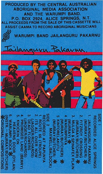Artist: b'REDBACK GRAPHIX' | Title: b'Cassette cover: Warumpi Band Jailanguru Pakarnu' | Date: 1980-94 | Technique: b'screenprint, printed in colour, from four stencils'