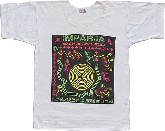 Artist: b'REDBACK GRAPHIX' | Title: b'T-shirt: Imparja.' | Date: 1985 | Technique: b'screenprint, printed in colour, from multiple stencils'
