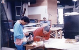 Title: Robert Campbell junior, working at the Australian Print Workshop, Melbourne on his linocut for the Bicentennial Folio. Pam Debenham in the background | Date: 1988