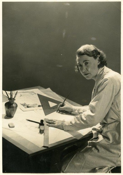 Title: b'Una Foster at her drafting table, early 1950s?'