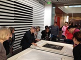 Artist: PRINT COUNCIL OF AUSTRALIA | Title: Anne Rowland, Ballarat Art Gallery, showing prints from trhe collection at the Big Day Out organised by the Print Council of Australia, 25 February 2017. | Date: 2017