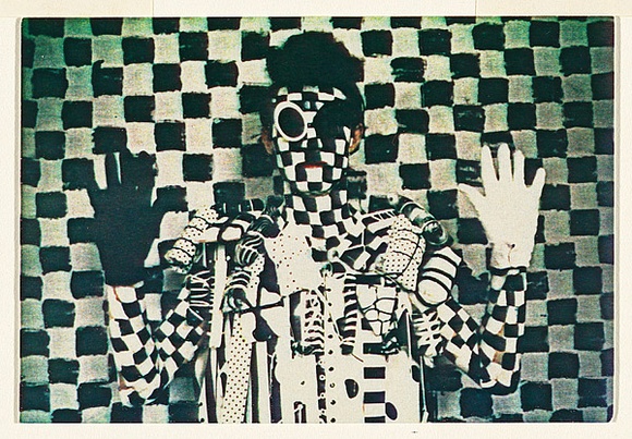 Artist: b'McDiarmid, David.' | Title: b'not titled [black and white man, angular]: postcard from the series Urban Tribalwear.' | Date: (1980) | Technique: b'photocopy, printed in colour' | Copyright: b'Courtesy of copyright owner, Merlene Gibson (sister)'