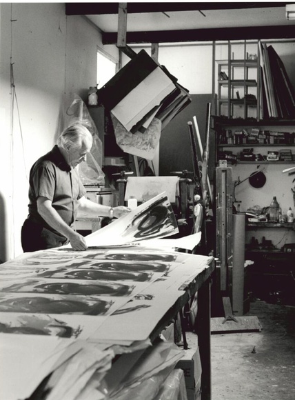 Title: b'Grahame King, Australian printmaker, sorting lithographs, at his studio at Warrandyte.'